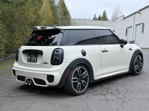 Rear view of a white MINI Cooper showcasing the MINI Cooper Stubby Jr Antenna 2 Inch Short Antenna Replacement For 2001 To 2026 Cars