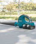 Badass 36V Cordless Leaf Blower Kit Cracks Yard Mess With Two 18V Batteries Pushing 155 CFM And 208 MPH Air Blast For Outdoor Cleanup Zero Hassle Brushless System Powers Long Sessions And Smooth Debris Clearing, featuring a sleek design and dual battery setup.