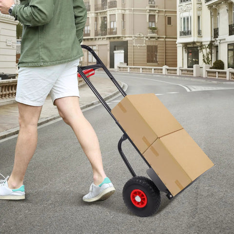 Person using Folding Flatbed Hand Truck With Telescoping Handle Two Wheel Portable Dolly Cart Heavy Duty Utility Cart For Home And Commercial Use 220 Lb Capacity Easy Fold To Store Quiet Ride Stable On Rough Surfaces