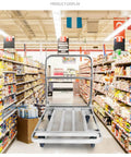 Heavy Duty Foldable Platform Push Cart With Smooth Rolling Rubber Wheels And Slick Stainless Steel Frame in a grocery aisle.