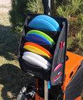 Power Pocket Disc Golf Cart Putter Pouch For Discs And Accessories That Lets You Grab Up To Eight Discs On The Fly Plus Easy Access To Your Rangefinder Phone And Keys While You Roll To The Next Hole attached to cart with discs visible