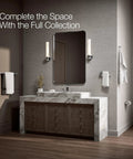 Bathroom with marble vanity, mirror, sconces, towel rack, and pivoting toilet paper holder that makes replacing rolls a breeze.