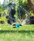 360 Degree Rotating Lawn Sprinkler System With Three Arm Design And Half Inch Connector in action on grass