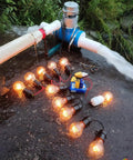 1000W Portable Water Turbine Generator 220V Micro Hydroelectric Power System With Aluminum Alloy Shell in outdoor setup powering light bulbs