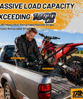 Man loading motorcycle using Heavy Duty Auto Retracting Tie Down Straps With Soft Loops, 1 Inch By 12 Feet, 1800 Pound Load Capacity