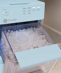 Portable Countertop Nugget Ice Maker Delivers Sick Chill Levels With Legit Chewable Snow Ice Ready Fast showing ice bin filled with ice.