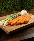 Acacia Wood Cutting Board With Feet 17 By 12 Inches Large Rectangle Heavy Duty Prep Board with vegetables on top