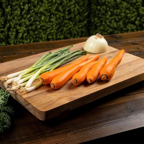 Acacia Wood Cutting Board With Feet 17 By 12 Inches Large Rectangle Heavy Duty Prep Board with vegetables on top