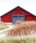 Red barn in field with Outdoor BGR P2 LED Dusk To Dawn Security Light Gray 4000K Efficient 36W 4700 Lumen Mega Bright Exterior Floodlight installed.
