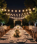 Outdoor LED String Lights 100 Ft With 52 Shatterproof G40 Vintage Edison Bulbs draped over elegant backyard dining setup