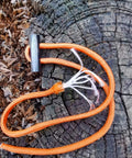Mini Ferro Rods Six Pack Drilled Ferrocerium Fire Starters for Camping and Emergencies, shown with orange paracord on wood