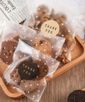 4x4 Cookie Bags With Thank You Stickers, Self Sealing Clear Cellophane Bags filled with cookies, displayed on a wooden tray