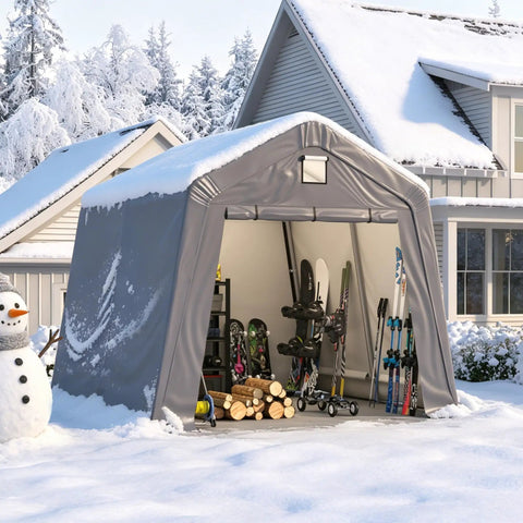 10x10 Outdoor Storage Shed Heavy Duty Portable Shelter Carport With Ventilation Windows And Roll Up Doors Backyard Must Have For Motorcycle Bike Lawn Mower And Garden Tools Gray in snow-covered yard with open door showing skis and logs