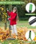 Girl using Double Sided Lawn Thatch Rake, 51 Inch Heavy Duty Metal Rake With 21 Teeth, 13 Inch Wide for leaf removal in garden
