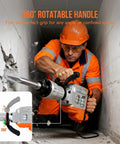 Man operating 1700W Electric Jackhammer Concrete Breaker With 1900 BPM Demolition Power in a wall corner with a 360° rotatable handle.
