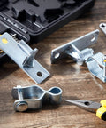 4 Pcs Heavy Duty Wall Mount Gate Hinges For Pipe Gates And Chain Link Fences on wooden surface, includes tools
