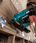 Worker using 18V LXT Cordless Framing Nailer With 21 Degree Full Round Head, 3-1/2 Inch, Tool Only, on timber frame construction