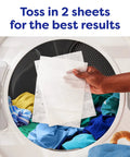 Person placing Unscented Dryer Sheets 240 Count For Sensitive Skin Hypoallergenic Dermatologist Tested into laundry dryer