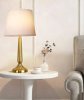 Touch Table Lamp Set for Bedroom Two Pack with USB Port and Power Outlet 3 Way Dimmable Bedside Lamps Daylight White Light Ideal for Living Room or Nursery Perfect for Nightstands and Desks Bulbs Included with gold base on white table beside grey couch