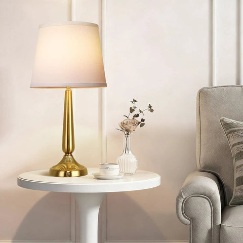 Touch Table Lamp Set for Bedroom Two Pack with USB Port and Power Outlet 3 Way Dimmable Bedside Lamps Daylight White Light Ideal for Living Room or Nursery Perfect for Nightstands and Desks Bulbs Included with gold base on white table beside grey couch