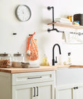 Monument Matte Black Cabinet Pull 5-1-16 Inch Center-To-Center installed on white kitchen cabinets, modern drawer handle, 5-7/16 Inch.