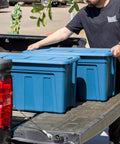 31 Gallon Storage Totes 8 Pack Built Like A Tank Heavy Duty Stackable Bins With Snap On Lids And Easy Grip Handles Eco Friendly Utility Tubs Made In USA Garage Organizing Gear Storage Navy on truck bed.