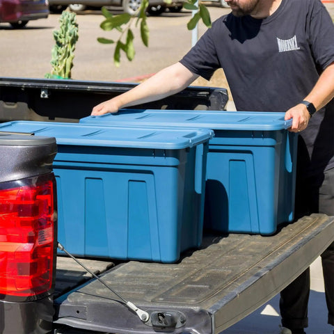 31 Gallon Storage Totes 8 Pack Built Like A Tank Heavy Duty Stackable Bins With Snap On Lids And Easy Grip Handles Eco Friendly Utility Tubs Made In USA Garage Organizing Gear Storage Navy on truck bed.
