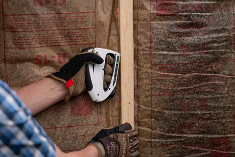 Person using TruTac TT21 Forward Action Staple Gun For Upholstery, Crafts, Decorating And Repairs, Manual Push Stapler on insulation