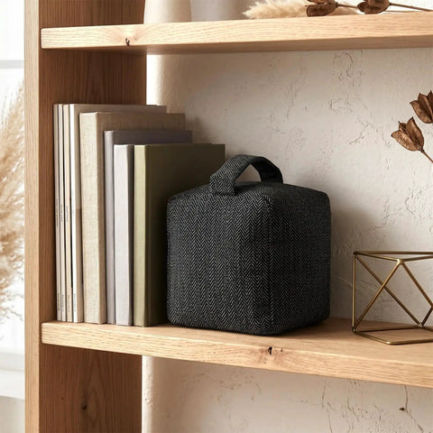 Heavy Duty Weighted Door Stopper With 4.4 Lb Internal Weight 6.3 Inch Square Base on a wooden shelf near books