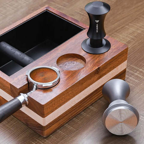 Espresso Tamper 51mm With Dual Spring Load Delivers 30 Lb Constant Pressure on a wooden knock box, ripple base visible