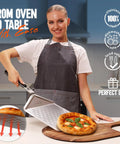 Woman using Perforated Pizza Peel 12 Inch With 10 Inch Folding Handle Stainless Steel Spatula Paddle for pizza transfer.