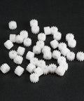 40 Piece Plastic Gear Set With 12 Tooth Model 122A Reduction Worm Gears, loose on black surface, for RC Cars and Robot Motors upgrade.