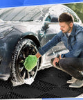 Man cleaning car tires on 72 Pcs 12x12 Interlocking Garage Floor Tiles Drainage Flooring Tough As Nails Non Slip Polypropylene Easy Install