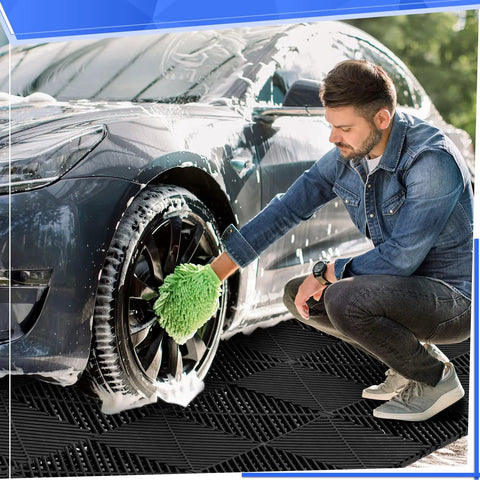 Man cleaning car tires on 72 Pcs 12x12 Interlocking Garage Floor Tiles Drainage Flooring Tough As Nails Non Slip Polypropylene Easy Install