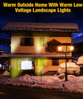 Snow-covered house at night lit by 16 Pack 3W LED Well Lights For Low Voltage Outdoor Landscape Lighting Kit