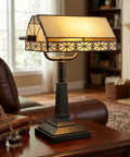 Tiffany Style Bankers Lamp With Stained Glass Shade For A Dope Desk Setup on wooden desk in cozy home office