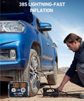 Heavy Duty 12V Air Compressor Portable Tire Pump Dropping A Solid 120 Psi Blast With Built In Led Lantern And Alligator Clamps Trail Ready For Trucks Suvs And Rv Built Like A Tank To Swallow 33 Inch Tires, man using pump on truck tire.