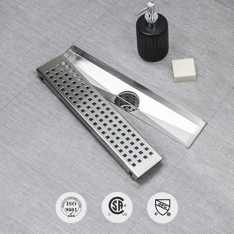 12 Inch Linear Shower Drain With Removable Square Panel, AISI 304 Stainless Steel Brushed Floor Drain With Adjustable Feet, Hair Strainer, 2 Inch Outlet And X Shaped Diversion Groove For No Clog displayed on tile surface