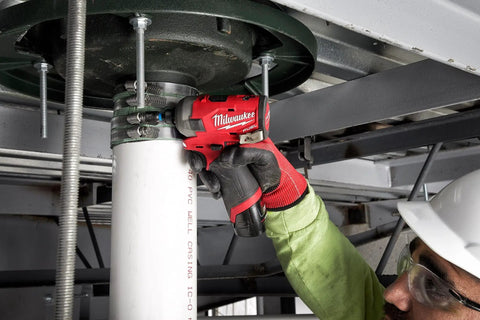 Worker using M12 FUEL Surge Compact Lithium Ion One Quarter Inch Cordless Hex Hydraulic Driver Tool Only in industrial setting