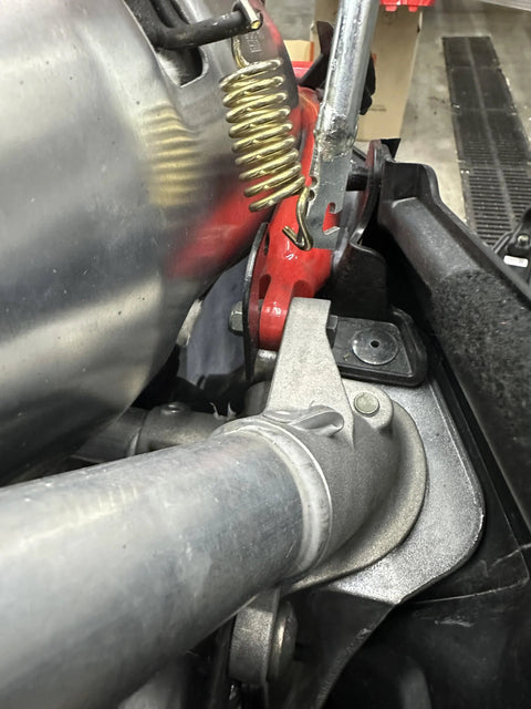 Exhaust spring removal tool, Push Industries 102.302, red handle with coil spring, 19-inch, close-up