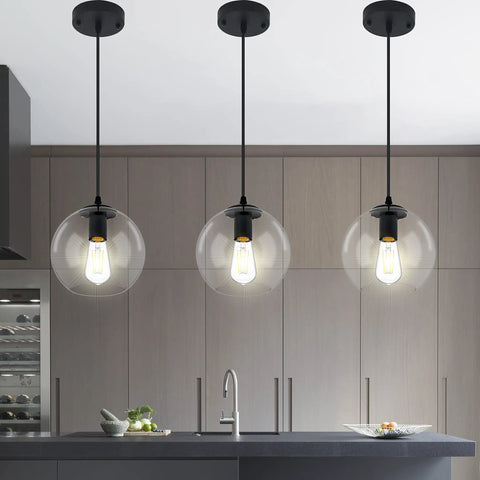 Industrial Farmhouse Globe Pendant Light Fixture With Adjustable Cord Black Hanging Ceiling Chandelier illuminating kitchen island.