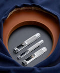 Pro Grade Leather Punch Set With Steel Hollow Punches, Three Piece Grommet Hole Punch Kit in fabric and leather backdrop