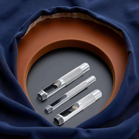 Pro Grade Leather Punch Set With Steel Hollow Punches, Three Piece Grommet Hole Punch Kit in fabric and leather backdrop