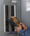 Person using the Straight Up Heavy Duty Jobsite Computer Connected Label Maker With Rechargeable Battery And Hard Case to label a circuit breaker panel.