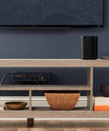 Eight Outlet Surge Protector Power Strip With Slim Profile And 3420 Joules Of Protection installed on a shelf under TV