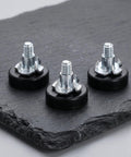 Close-up of Adjustable Furniture Leveling Feet Kit 12 Pcs With T Nuts And Anti Slip Pads 1/4 Inch Thread Carbon Steel And PP Build.