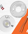 Hardwire Smoke Alarm With 10 Year Battery Backup And Strobe Light Wielding Precision Detection To Dodge Nuisance Cooking Alarms And Bring Big Time Safety To Your Pad With Zero Hassle And No More Battery Changes Or Grumbling Ever showing the unit and mounting bracket with screws.