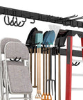 Heavy Duty Garage Tool Storage Rack Wall Mounted Organizer With 12 Double Hooks and 4 Rails, shown with tools and ladder
