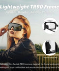 Badass Photochromic Safety Glasses with No Cap Impact Resistance for Cycling and Motorcycle Riding Featuring Rustproof Frames and Lightweight ANSI Z87 Approved Gear That Slaps for Worksite or Outdoor Adventures with a woman outdoors.