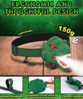 Dinosaur Headlamp For Kids With LED Flashlight Roar And Silent Modes, T Rex Dino Toy with adjustable headband on wood surface